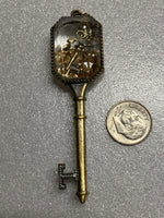 Key Pendant with Movable Pieces Inside