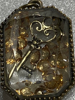 Key Pendant with Movable Pieces Inside