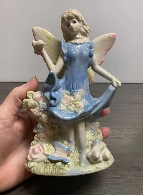 Porcelain Fairy Holding Bird