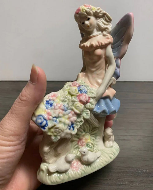 Porcelain Fairy Pushing Wheelbarrow Full of Flowers