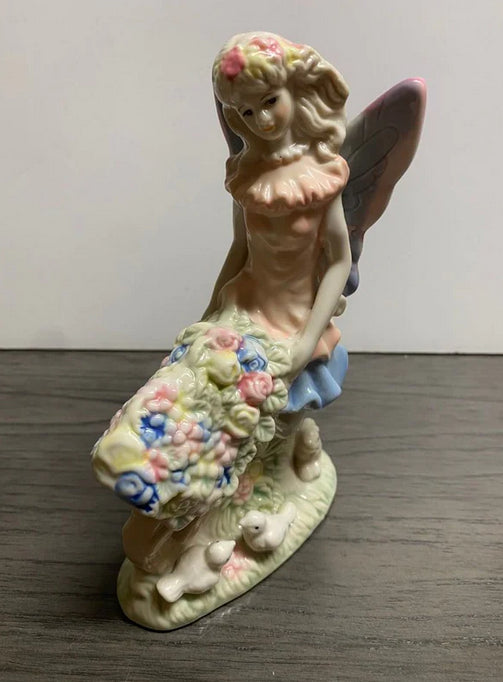 Porcelain Fairy Pushing Wheelbarrow Full of Flowers