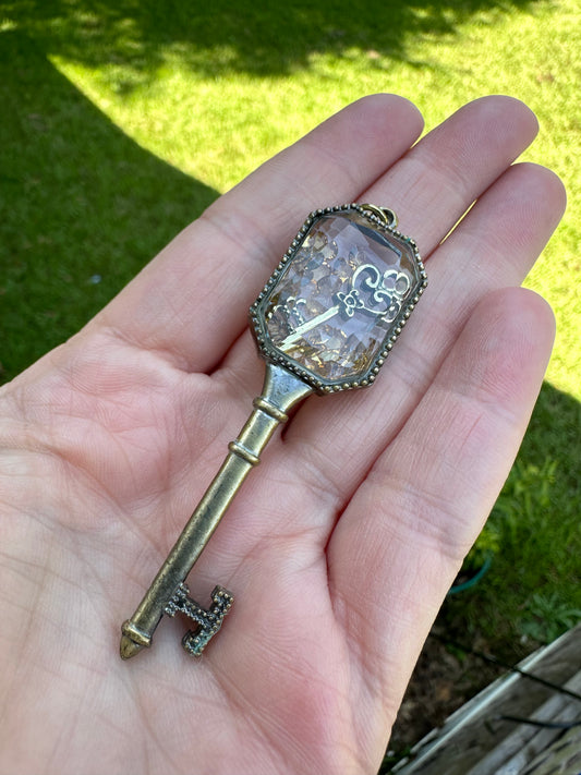 Key Pendant with Movable Pieces Inside